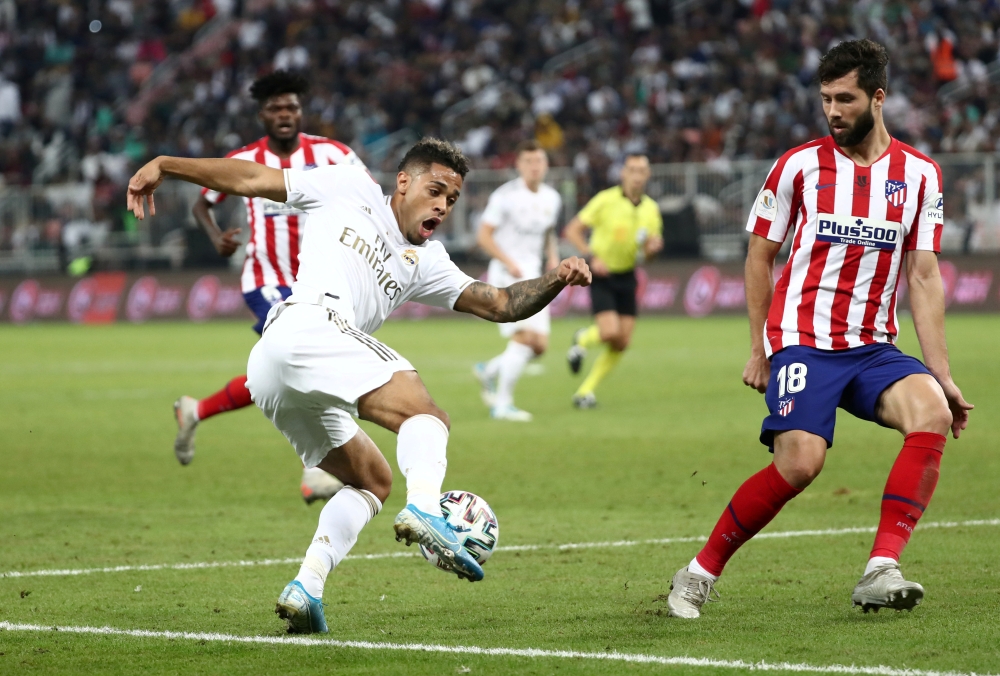 FILE PHOTO: Soccer Football - Spanish Super Cup Final - Real Madrid v Atletico Madrid - King Abdullah Sports City, Jeddah, Saudi Arabia - January 12, 2020 Atletico Madrid's Felipe in action with Real Madrid's Mariano Diaz REUTERS/Sergio Perez/File Photo