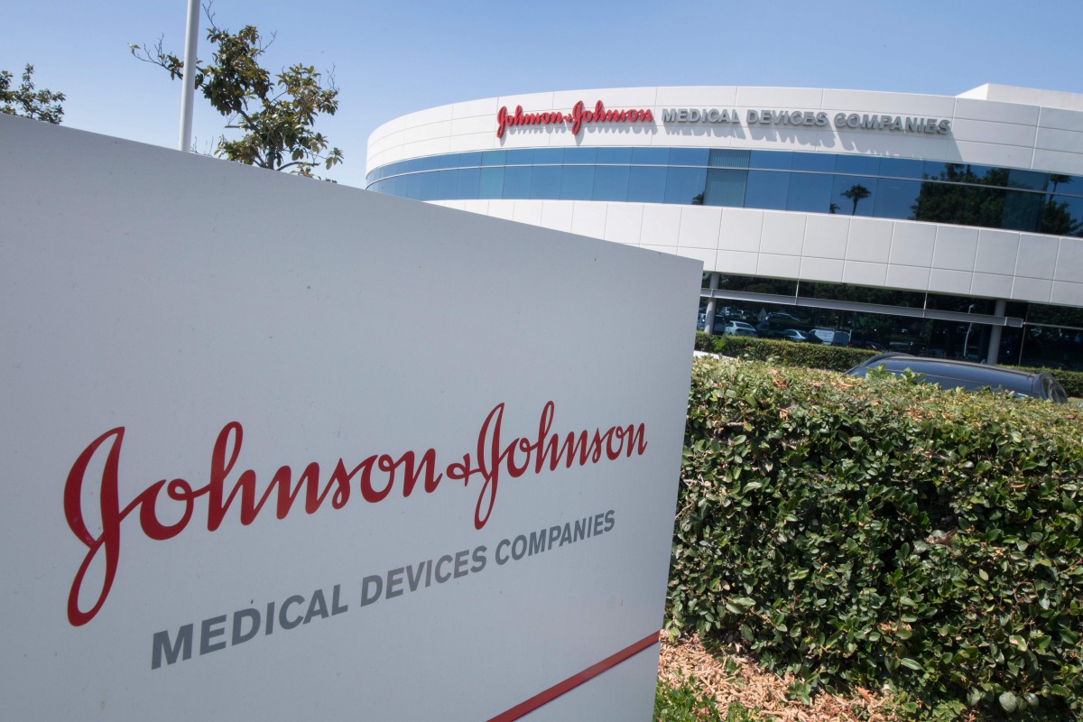 (FILES) In this file photo the Johnson & Johnson logo is seen above an entrance to a building at their campus in Irvine, California on August 28, 2019. 
/ AFP / Mark RALSTON