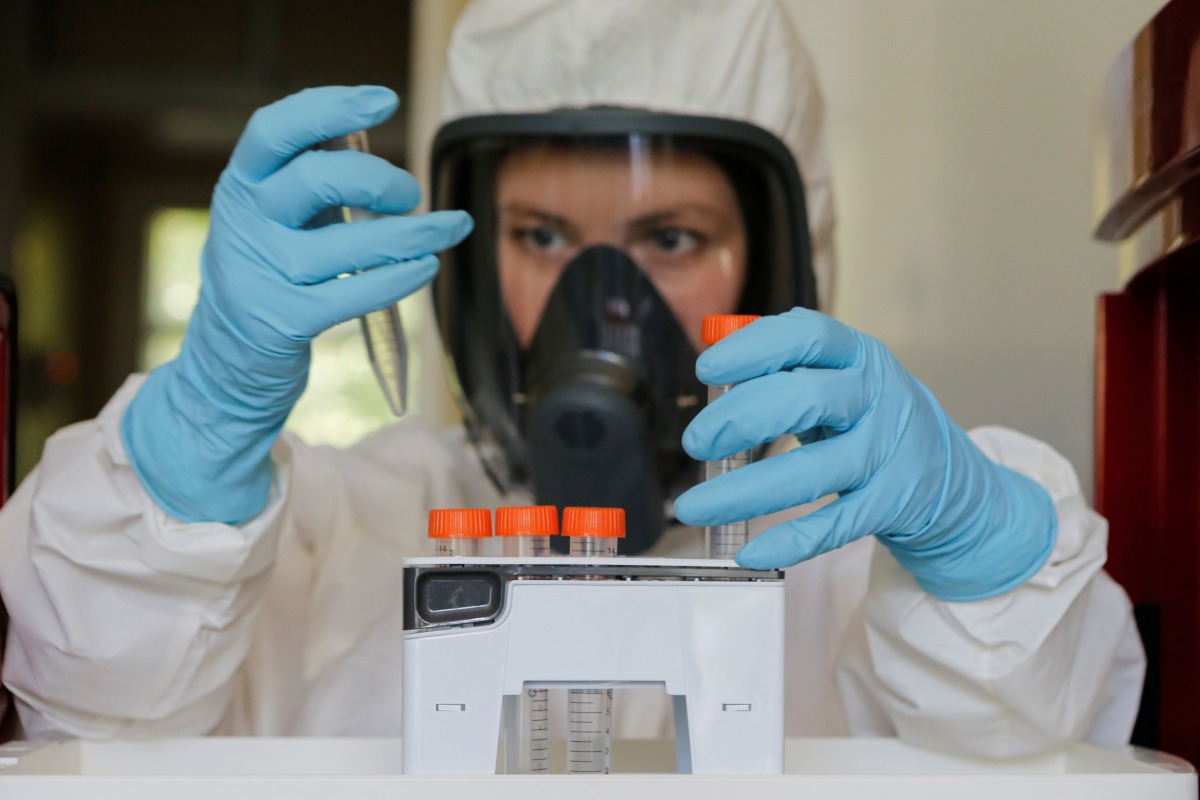 A scientist works inside a laboratory of the Gamaleya Research Institute of Epidemiology and Microbiology during the production and laboratory testing of a vaccine against the coronavirus disease (COVID-19), in Moscow, Russia August 6, 2020. Picture taken