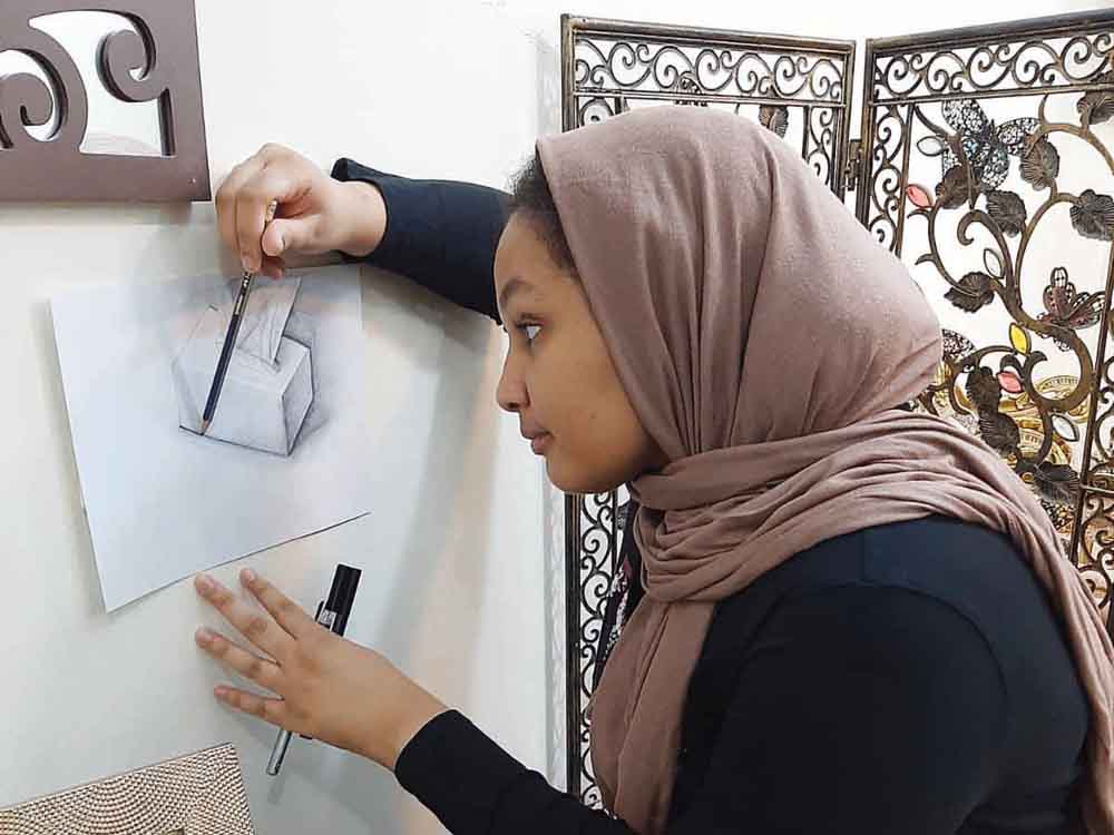 Jumana Bakri working on a project at home.