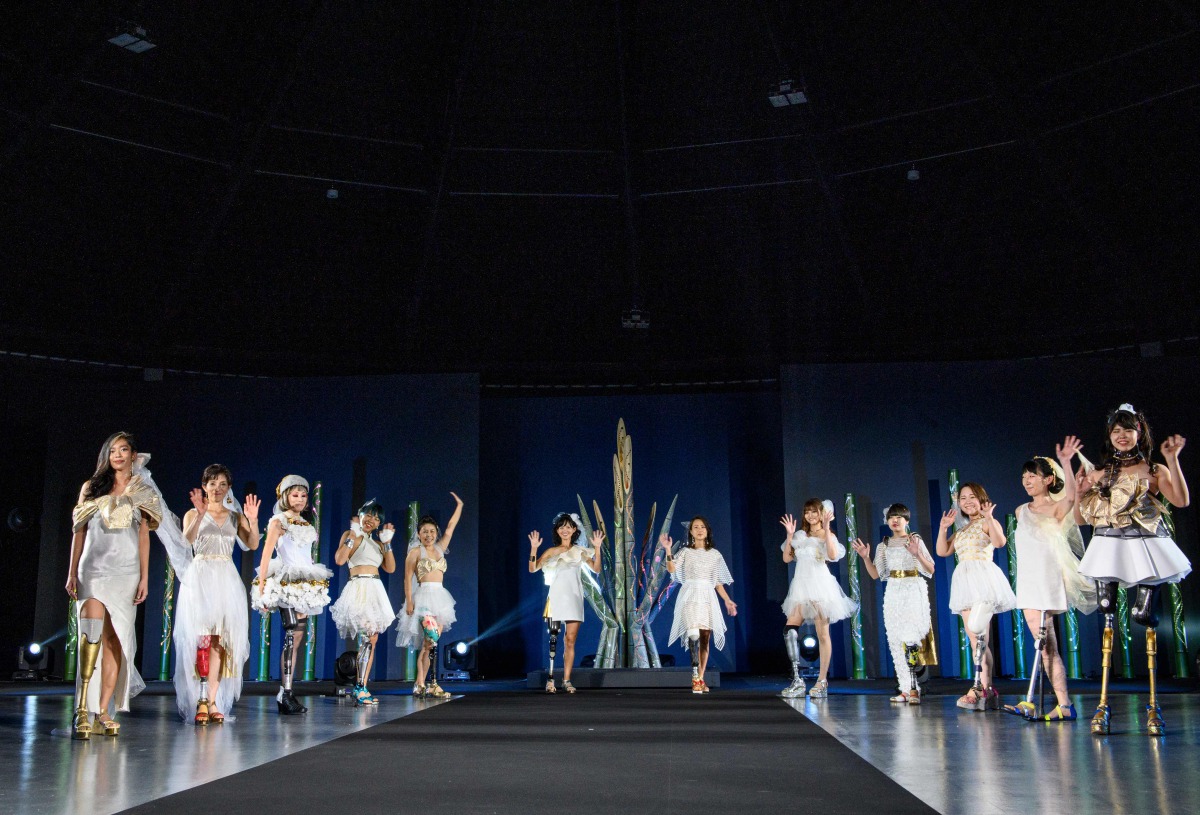 Women with prostheses display creations by designer Makiko Sugawa during the Amputee Venus fashion show in Tokyo on August 25, 2020. / AFP / Philip FONG
