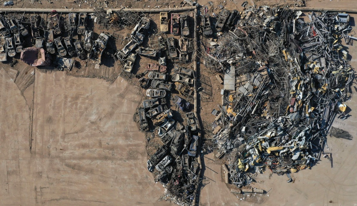 TOPSHOT - An aerial view taken on August 26, 2020, shows imported vehicles damaged at the port of Beirut in the August 4 massive explosion that caused severe damage across swathes of the Lebanese capital, killed at least 181 people, injured more than 6,50