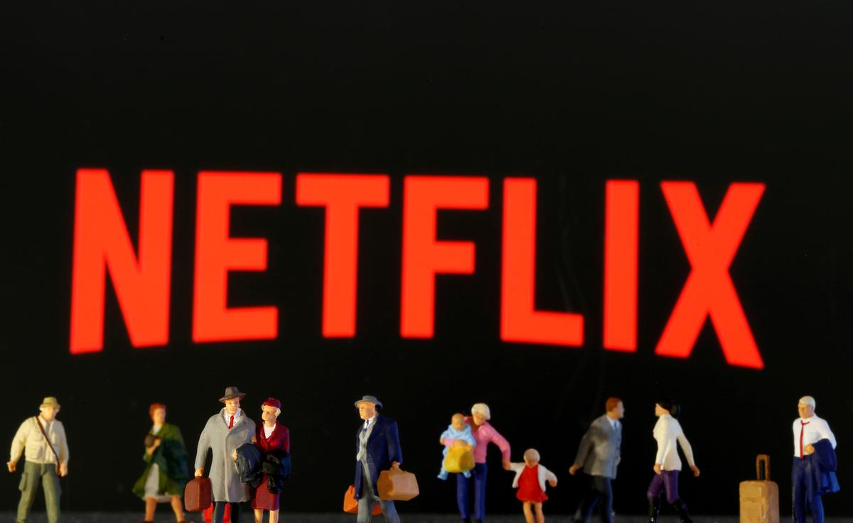 FILE PHOTO: Small toy figures are seen in front of diplayed Netflix logo in this illustration taken March 19, 2020. REUTERS/Dado Ruvic/Illustration/File Photo
