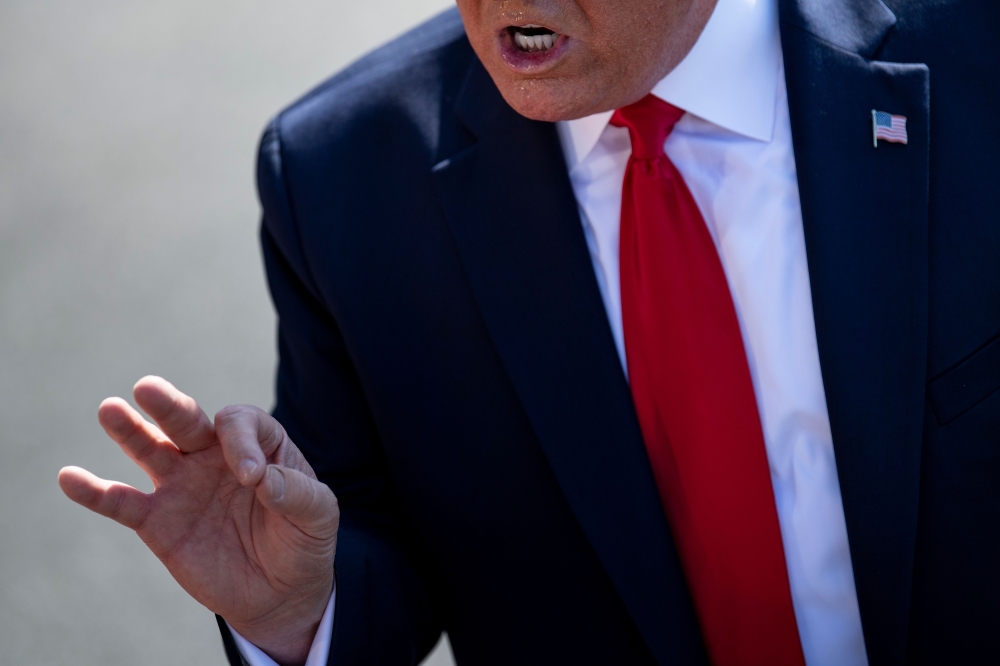 FILE PHOTO: US President Donald Trump makes a point during a press conference with US Labor Secretary Alexander Acosta early July 12, 2019 at the White House in Washington, DC.  AFP / Brendan Smialowski