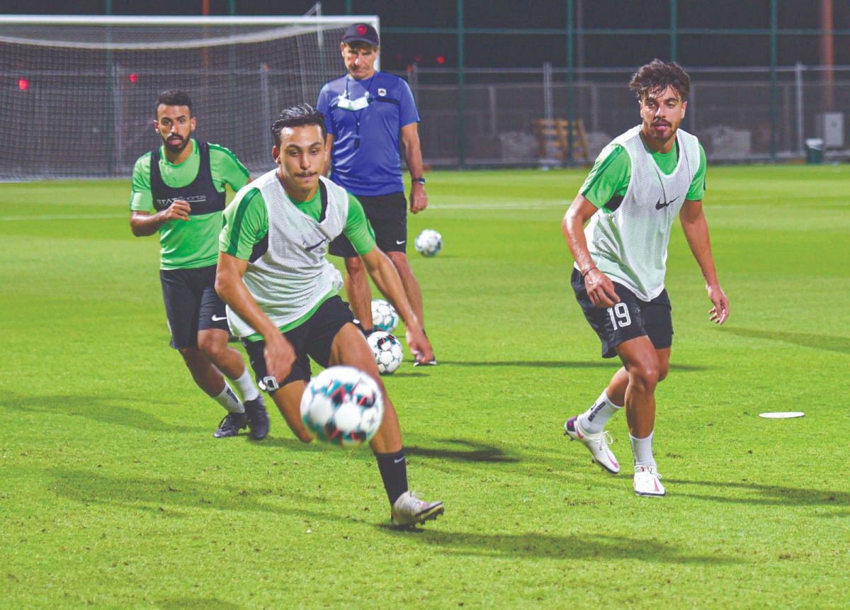 Al Rayyan players in action during a pre-match training session
