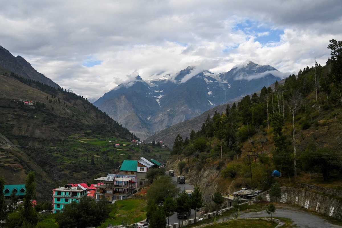 In this picture taken on September 3, 2020, an Indian Army convoy makes way along a highway in Kyelang, some 120 kilometres (75 miles) from the Indo-Tibetan border. China and India shifted the blame on September 8 after the first shots in decades were fir