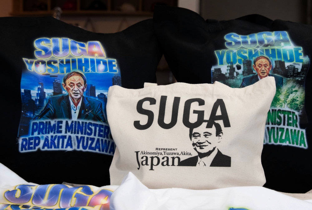 Merchandise featuring Japan's expected new prime minister Yoshihide Suga are displayed at designer Ippei Fujita's store Marble in Yuzawa, Akita Prefecture, Japan, September 11, 2020. Picture taken on September 11, 2020. REUTERS/Chris Gallagher