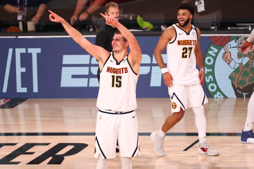 Denver Nuggets center Nikola Jokic (15) celebrates after defeating the Los Angeles Clippers in game seven of the second round of the 2020 NBA Playoffs at ESPN Wide World of Sports Complex. Kim Klement