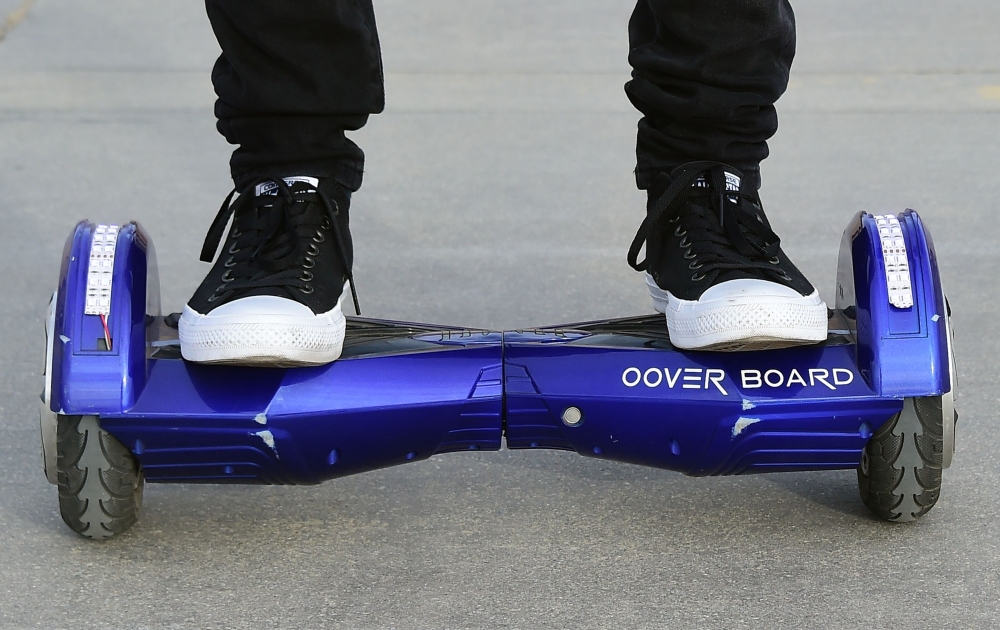 (FILES) In this file photo taken on December 10, 2015 Michael Tran uses his hoverboard on the Venice Beach Boardwalk. AFP / Frederic J. BROWN