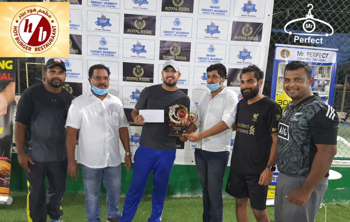 Dynamite captain (third left) receiving the trophy.