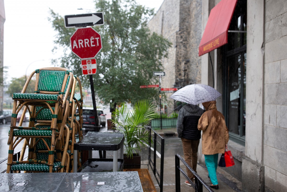 FILE PHOTO: Chairs are stacked outside a bistro as the Quebec government has ordered all restaurants, bars and casinos to close for 28 days effective midnight September 30 as coronavirus disease (COVID-19) numbers continue to rise in Montreal, Quebec, Can