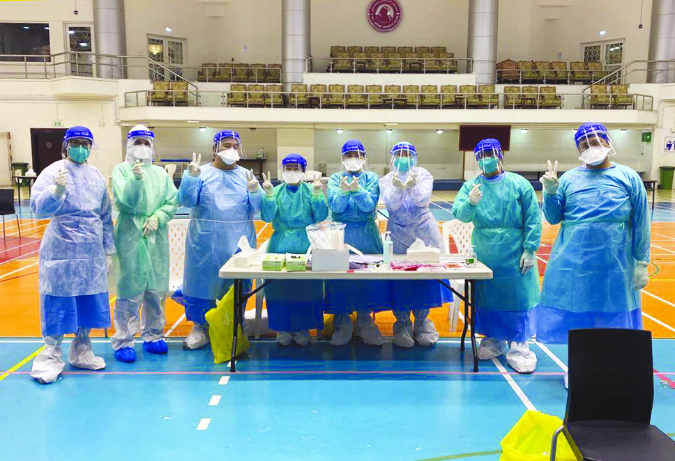 Staff of Qatar Care during a voluntary work to fight COVID-19 pandemic.