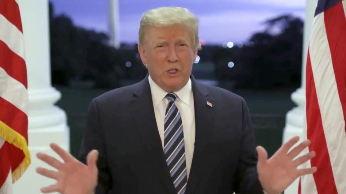 FILE PHOTO: U.S. President Donald Trump speaks at the White House after returning from hospitalization at the Walter Reed Medical Center for coronavirus disease (COVID-19) treatment, in Washington, October 5, 2020, in this still image from video posted on