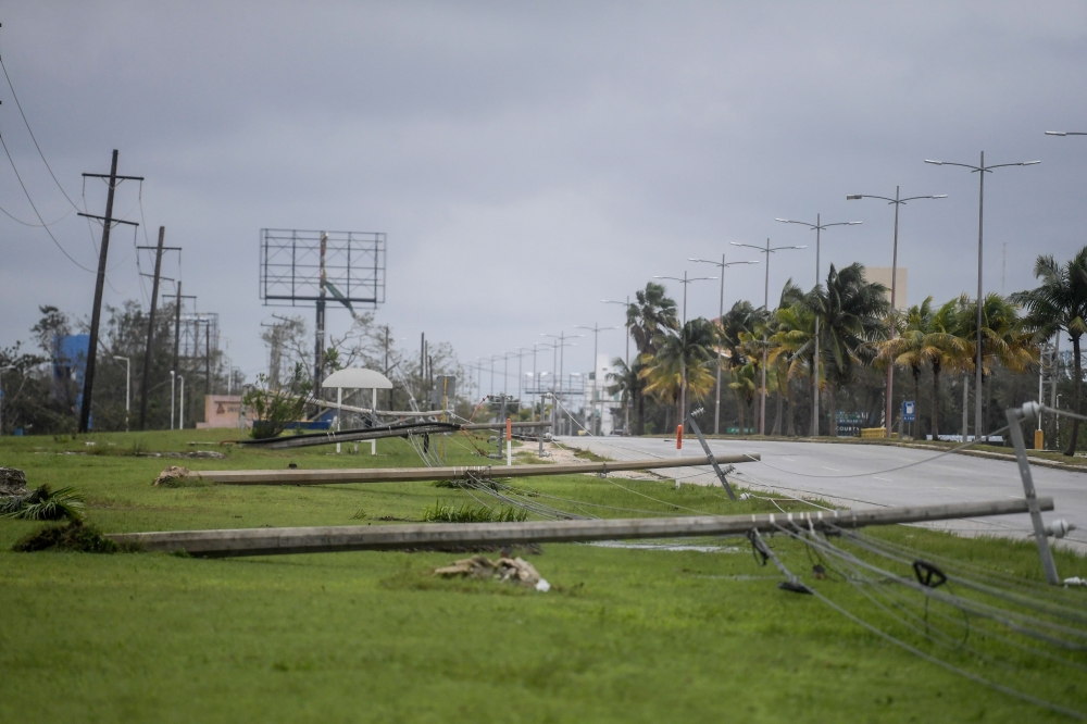 View of fallen power lines after the passage of Hurricane Delta in Cancun, Quintana Roo state, Mexico, on October 7, 2020. Hurricane Delta slammed into Mexico's Caribbean coast early Wednesday, toppling trees, ripping down power lines and lashing a string