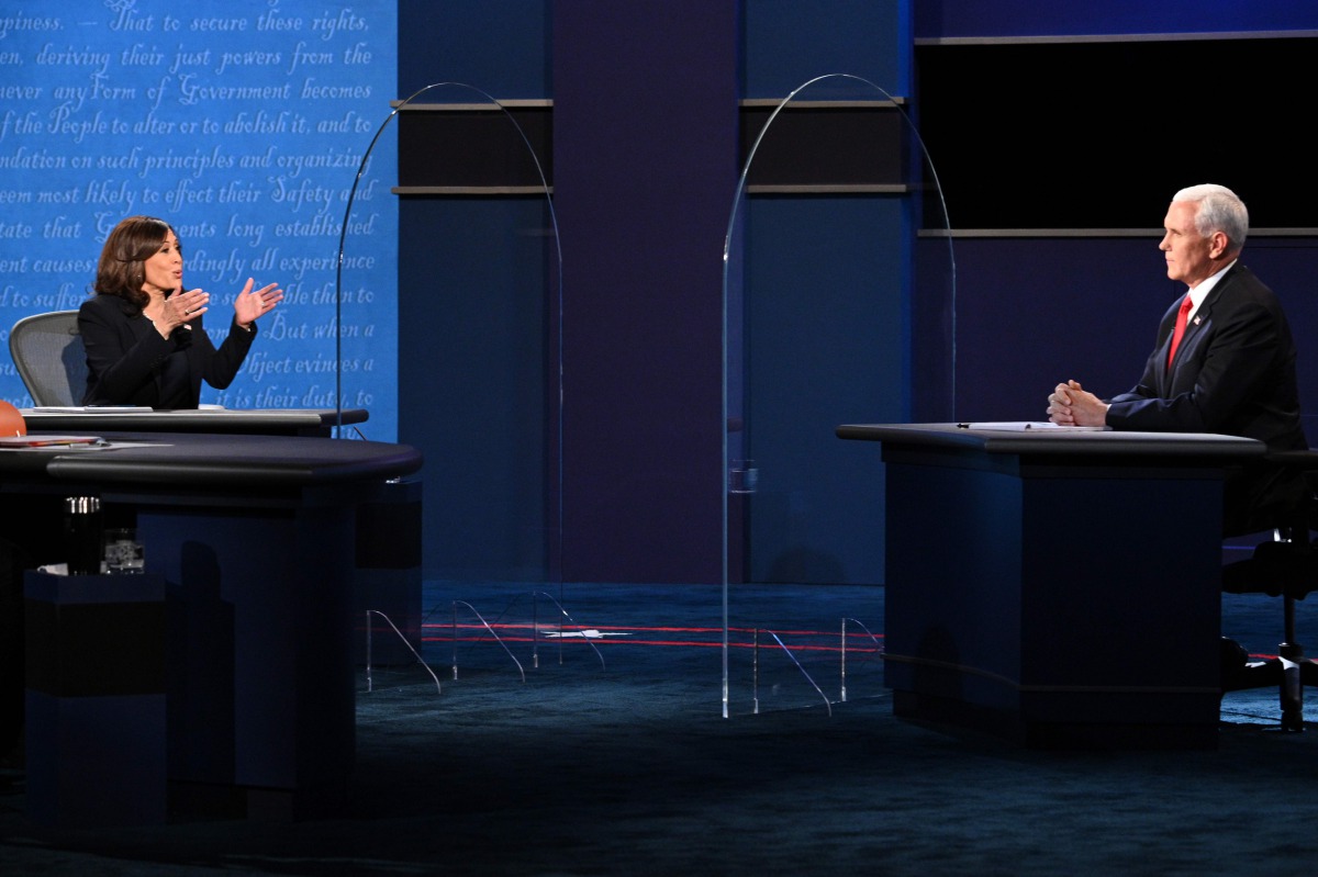 TOPSHOT - US Democratic vice presidential nominee and Senator from California, Kamala Harris (L) gestures toward US Vice President Mike Pence Mike Pence as she speaks during the vice presidential debate in Kingsbury Hall at the University of Utah on Octob