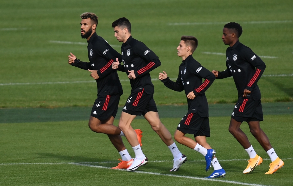 Bayern Munich's new Cameroon forward Eric Maxim Choupo-Moting, Bayern Munich's Spanish midfielder Marc Roca, Bayern Munich's Portuguese midfielder Tiago Dantas and Bayern Munich's French defender Bouna Sarr run during an individual trainings session at th