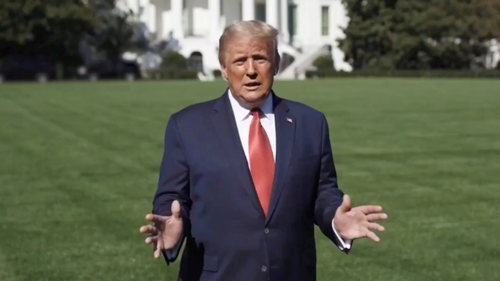 U.S. President Donald Trump speaks outside the White House, where he is being treated for the coronavirus disease (COVID-19), in Washington, U.S. in this still image taken from social media video released on October 8, 2020. @realDonaldTrump/via REUTERS