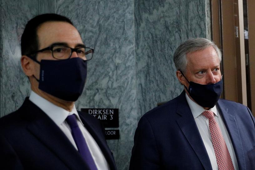 FILE PHOTO: U.S. Treasury Secretary Steve Mnuchin takes questions from news reporters with White House Chief of Staff Mark Meadows following a series of meetings on efforts to pass new coronavirus aid legislation on Capitol Hill in Washington, U.S., July 