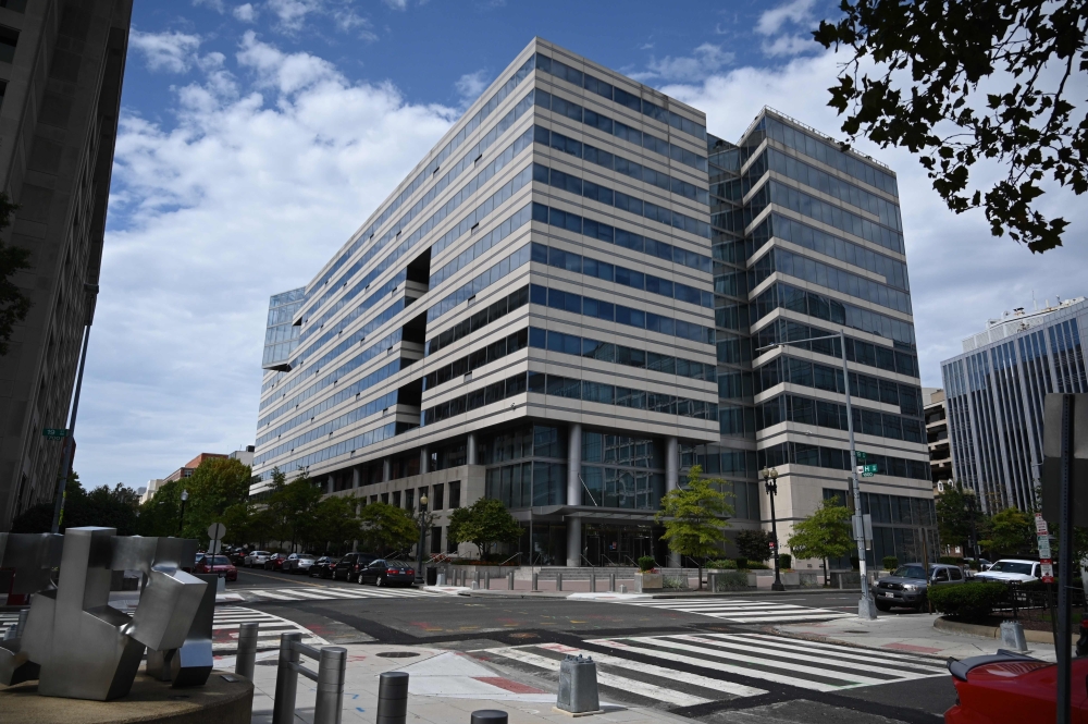 In this file photo the street corner between the World Bank headquarters and the IMF building is seen in Washington, DC on October 1, 2020. The World Bank said Tuesday that it approved $12 billion for developing countries to finance the purchase and distr