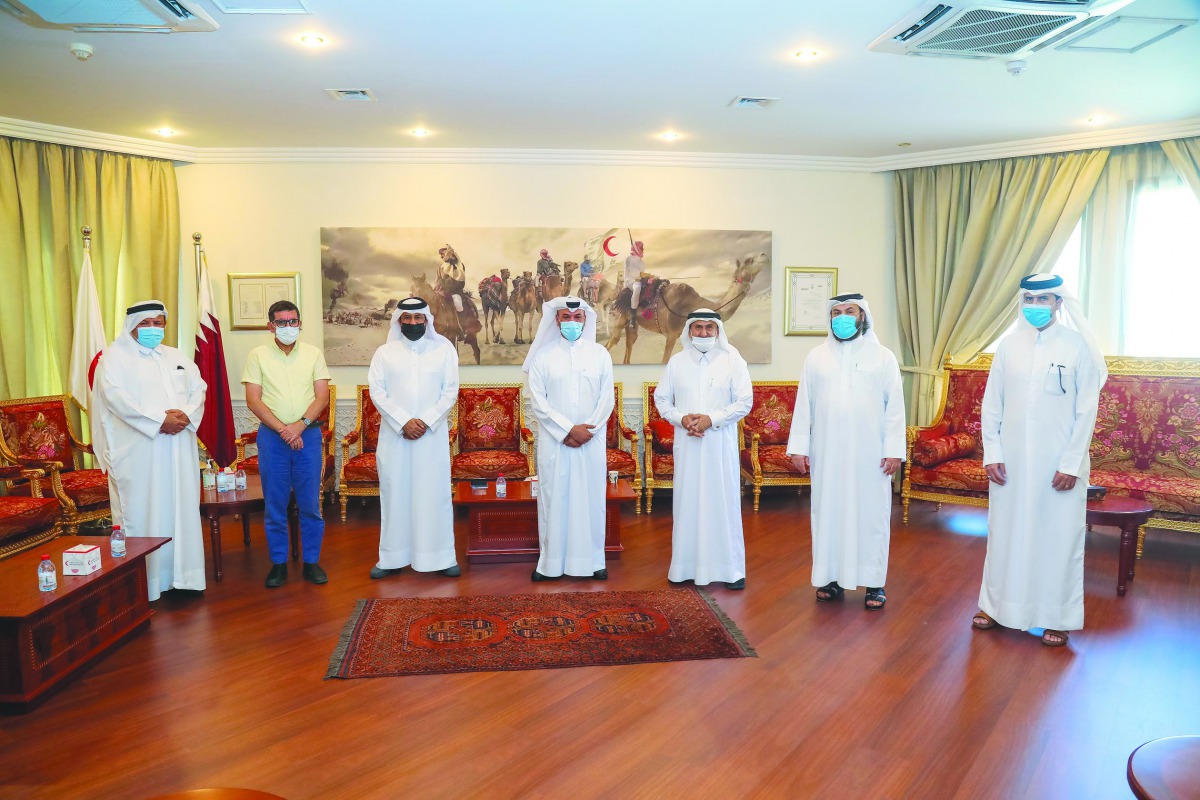 Secretary-General of QRCS, Ali bin Hassan Al Hammadi, with Al Markhiya Sports Club delegation.