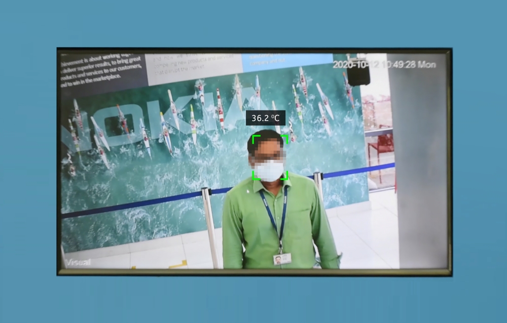 An undated Handout image shows an employee going through Nokia's automated COVID-19 detection system in Chennai, India. Nokia/Handout via REUTERS