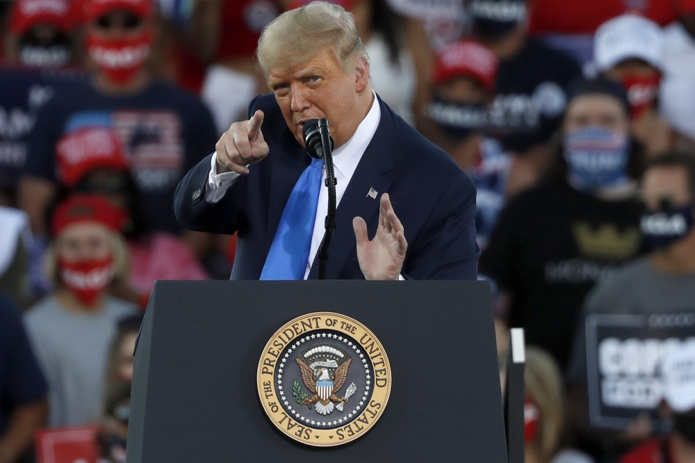 President Donald Trump gestures during a campaign rally on October 18, 2020, in Carson City, Nevada. Stephen Lam/Getty Images/AFP