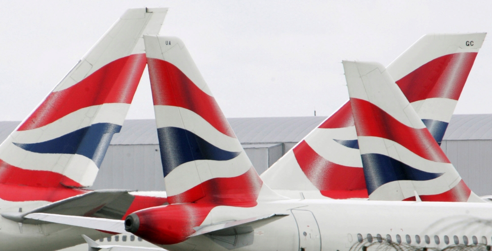 FILE PHOTO: British Airways aircraft are seen stationary on the tarmac of London's Heathrow Airport in west London, August 12, 2005. REUTERS/Toby Melville/File Photo