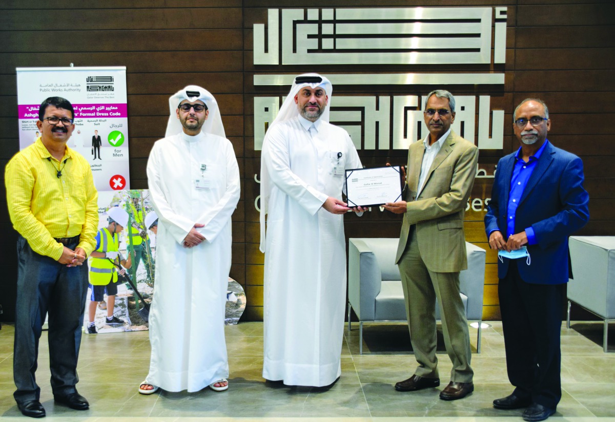 Ashghal and Galfar Al Misnad officials during the event.