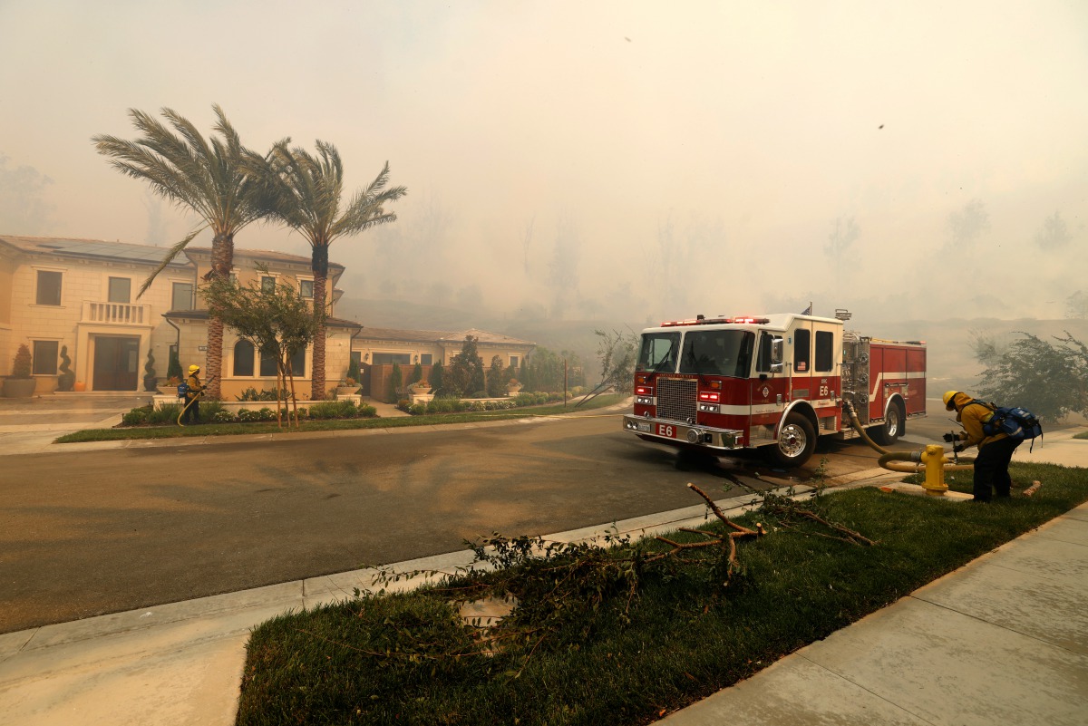 A fire truck is seen as the Silverado Fire is approaching, near Irvine, California, U.S. October 26, 2020. REUTERS/Mike Blake
