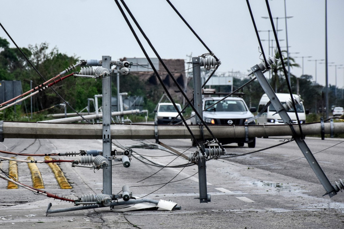 View of fallen power lines after the passage of Hurricane Zeta, in Puerto Morelos, Quintana Roo state, Mexico, on October 27, 2020. Zeta was downgraded to a tropical storm on Tuesday after making a landfall on Monday night as a category 1 hurricane near t
