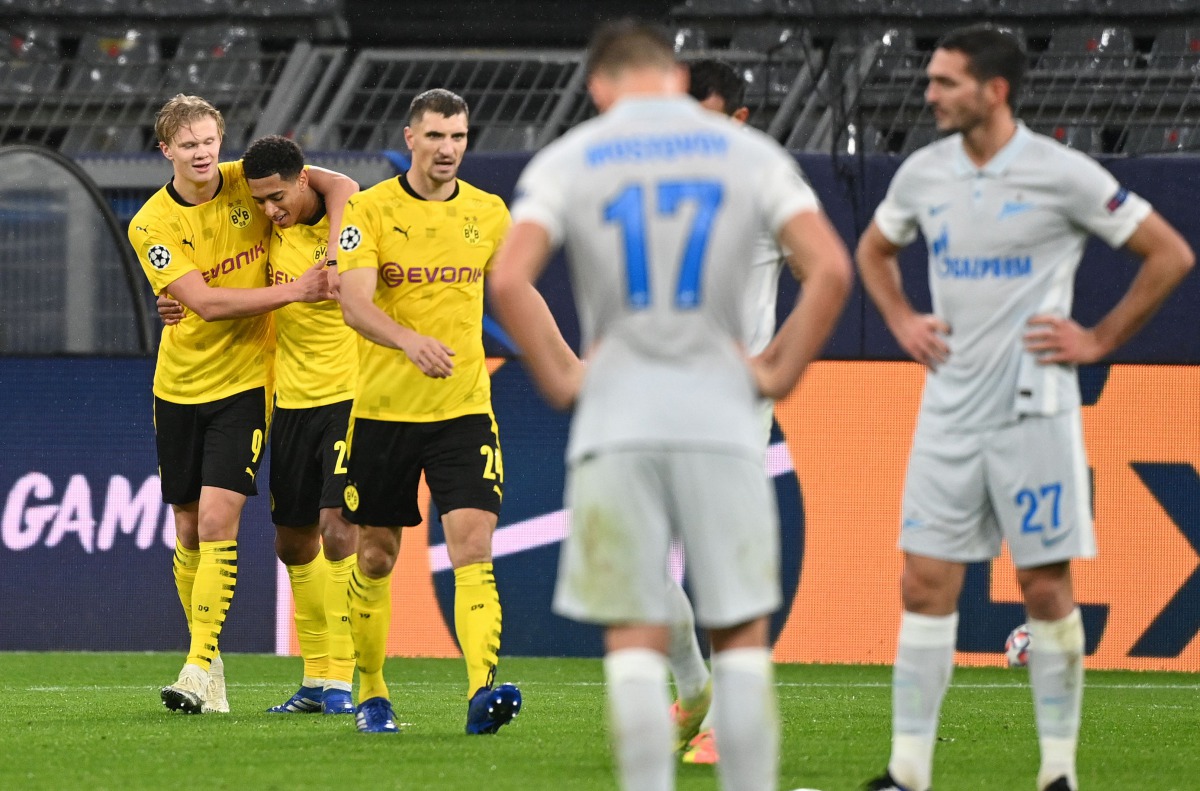Dortmund's Norwegian forward Erling Braut Haaland (L) celebrates scoring with the 2-0 goal his team-mates during the UEFA Champions League group F football match BVB Borussia Dortmund v FC Zenit Saint Petersburg in Dortmund, western Germany on October 28,