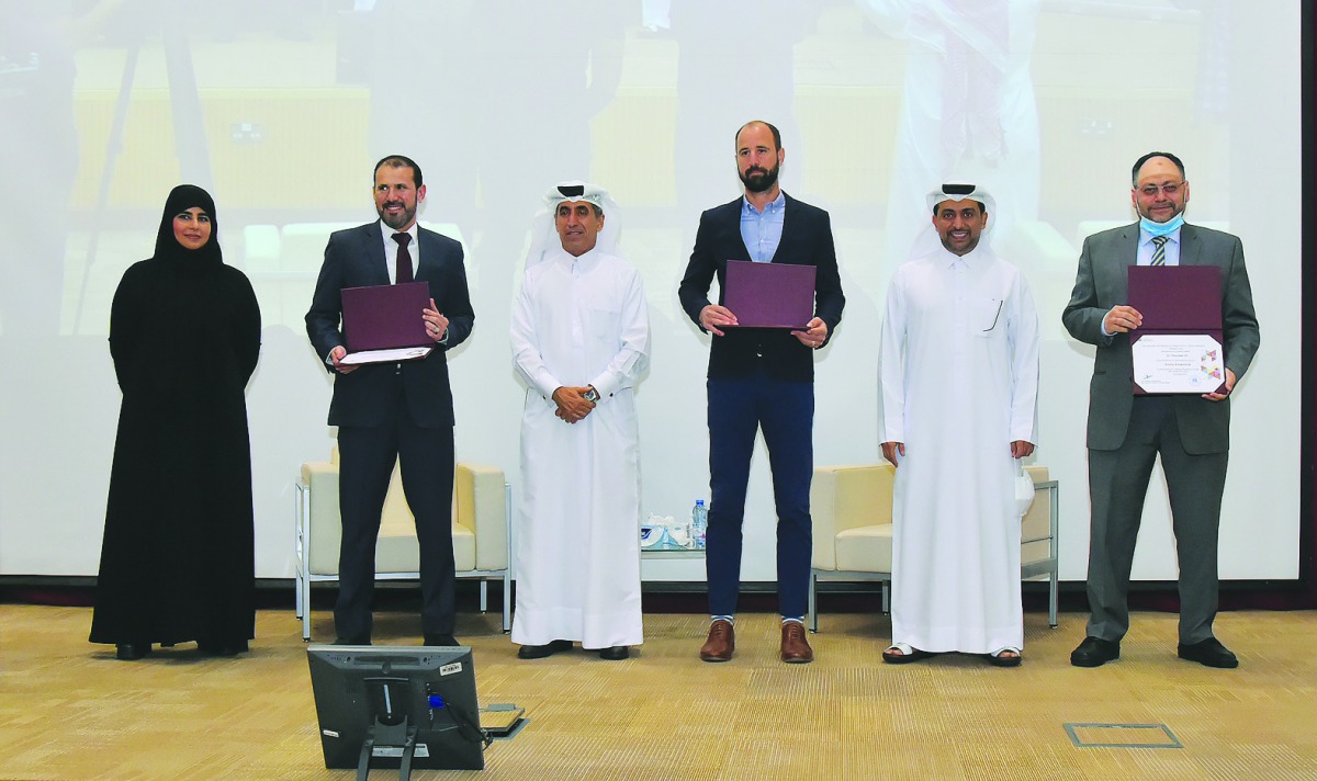 Undersecretary of the Ministry of Education and Higher Education, H E Dr. Ibrahim bin Saleh Al Nuaimi and QU President, Dr. Hassan Rashid Al Derham, with other officals at the event. 