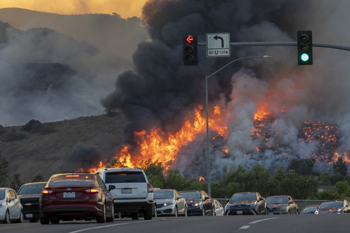 CHINO HILLS, CA - OCTOBER 27: Traffic is diverted off of the 71 freeway during the Blue Ridge Fire on October 27, 2020 in Chino Hills, California. Strong Santa Ana Winds gusting to more than 90 miles per hour have driven the Blue Ridge Fire and Silverado 