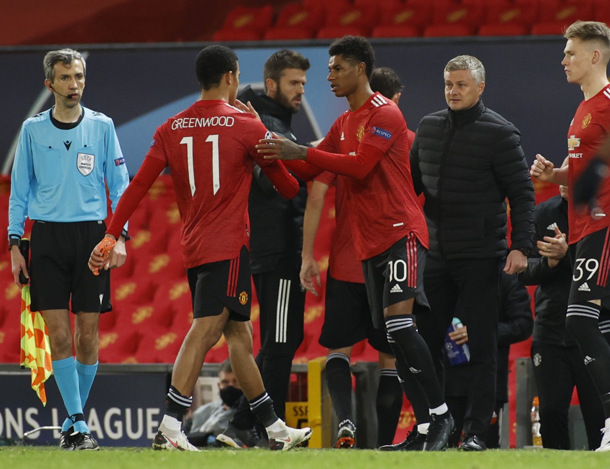 Soccer Football - Champions League - Group H - Manchester United v RB Leipzig - Old Trafford, Manchester, Britain - October 28, 2020 Manchester United's Marcus Rashford comes on as a substitute to replace Mason Greenwood as manager Ole Gunnar Solskjaer lo