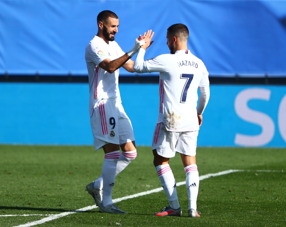 Real Madrid's Eden Hazard celebrates scoring their first goal with Karim Benzema REUTERS/Javier Barbancho