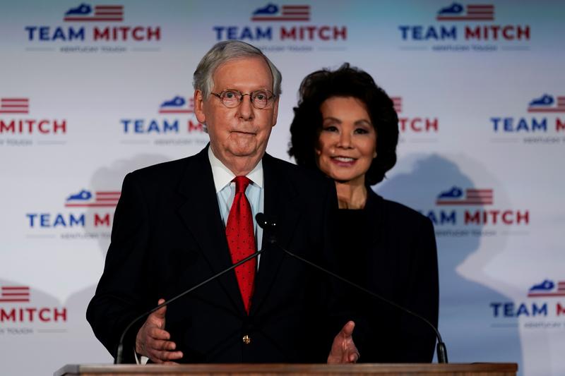 Senate Majority Leader Mitch McConnell (R-KY), accompanied by U.S. Secretary of Transportation Elaine Chao, holds a post election news conference as he declares victory, in Louisville, Kentucky, U.S., November 3, 2020. REUTERS/Bryan Woolston