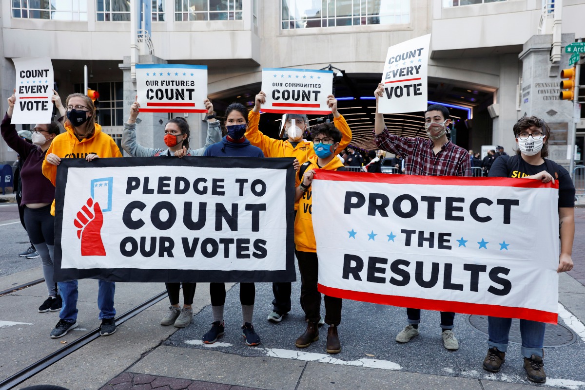 Demonstrators protest at the site Eric Trump was supposed to hold a news conference but was postponed, in Center City, Philadelphia, Pennsylvania, U.S., November 4, 2020. REUTERS/Rachel Wisniewski
