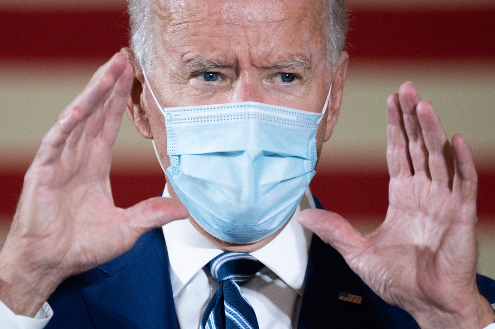In this file photo former Democratic presidential candidate Joe Biden speaks during a campaign event in Fort Lauderdale, Florida on October 13, 2020. US President-elect Joe Biden on November 9, 2020 named the scientists who will lead his administration's 