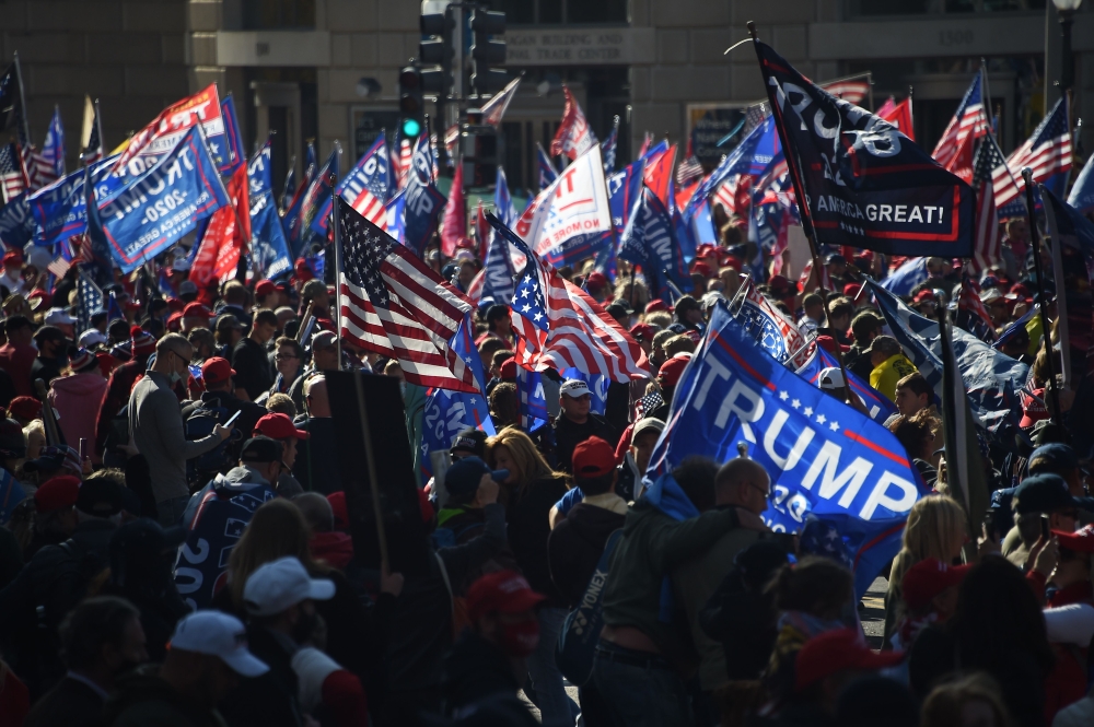 Supporters of US President Donald Trump rally in Washington, DC, on November 14, 2020. Supporters are backing Trump's claim that the November 3 election was fraudulent. / AFP / Olivier DOULIERY