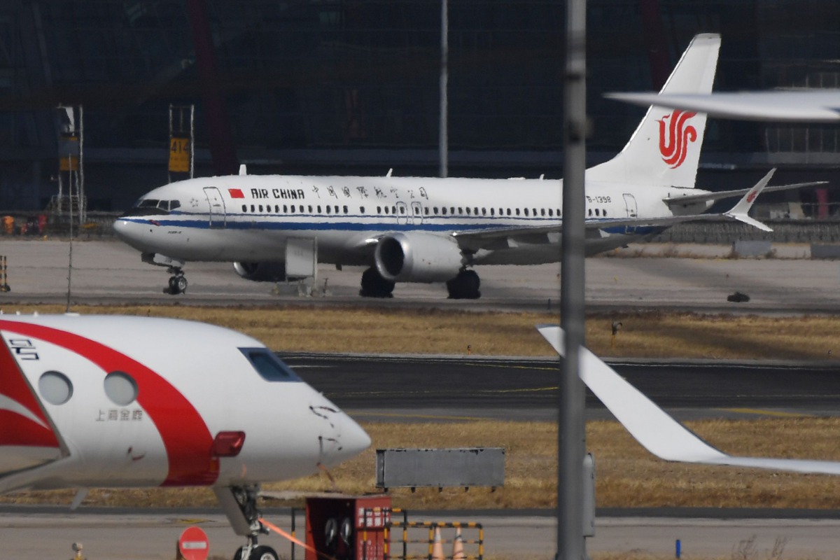 (FILES) This file photo taken on March 11, 2019 shows an Air China Boeing 737 MAX 8 plane at Beijing Capital Airport. China's aviation regulator said on November 20, 2020 it will not yet allow Boeing's troubled 737 MAX jet to fly in the company's biggest 