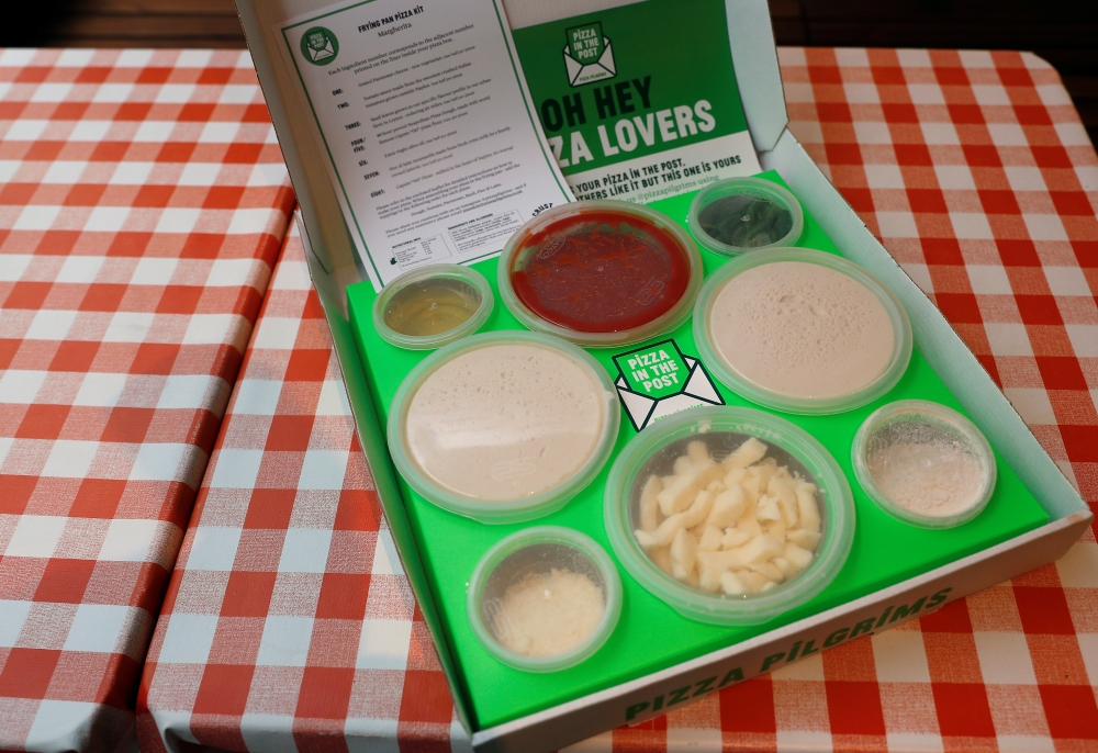 A Pizza Pilgrims, Pizza in the Post kit, is seen prior to cooking amid the coronavirus disease (COVID-19) outbreak in London, Britain, November 20, 2020. Picture taken November 20, 2020. REUTERS/Peter Nicholls