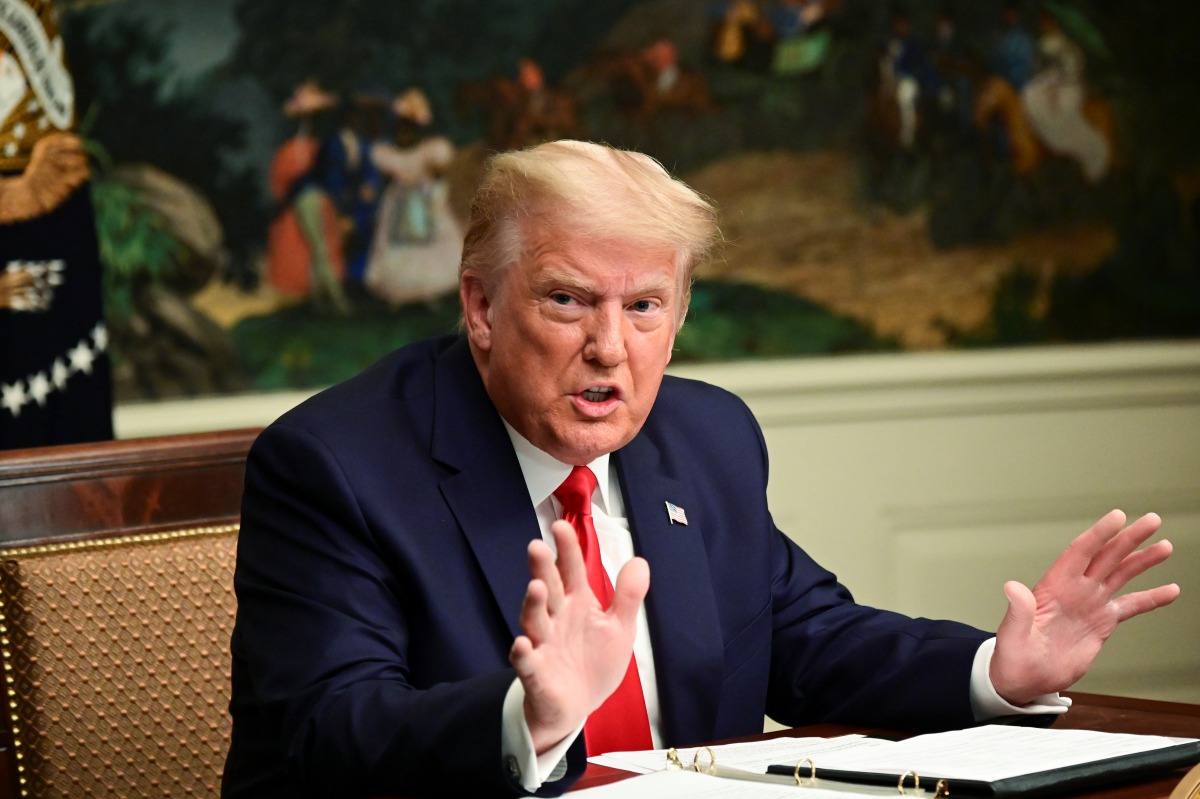 U.S. President Donald Trump participates in a Thanksgiving video teleconference with members of the military forces at the White House in Washington, U.S., November 26, 2020. REUTERS/Erin Scott

