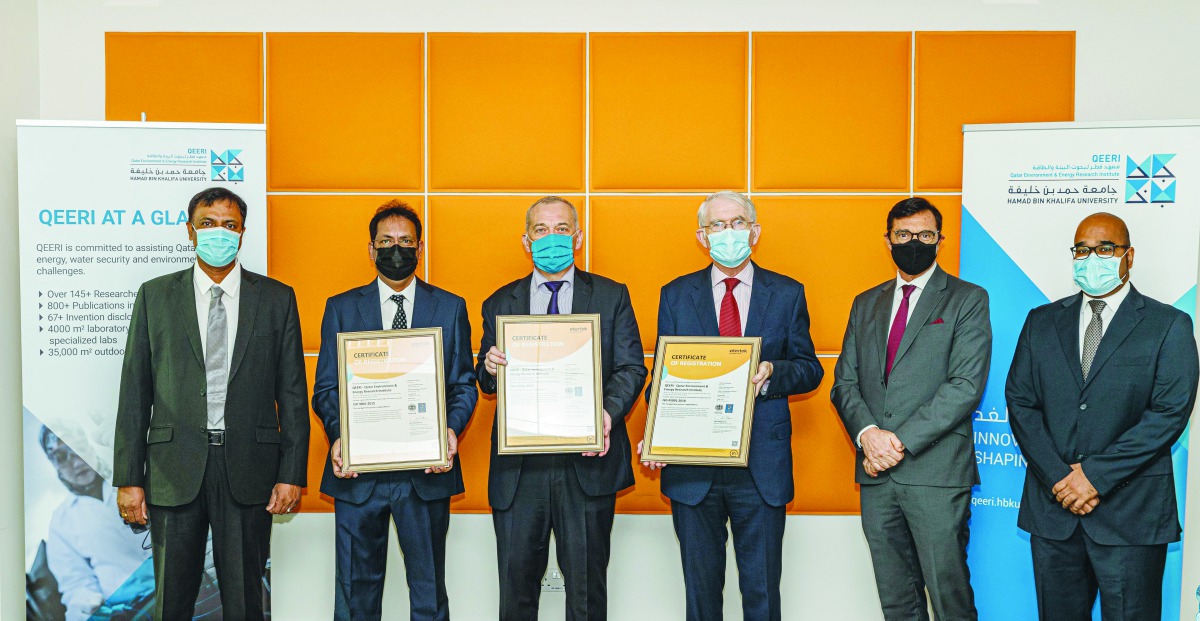Representatives from Intertek and QEERI during ISO certifications presenting event. 
