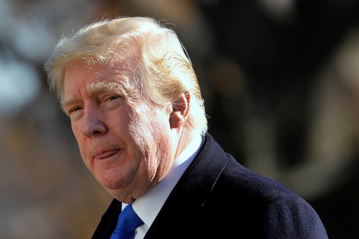 U.S. President Donald Trump walks on the South Lawn of the White House upon his return to Washington from Camp David, U.S., November 29, 2020. REUTERS/Yuri Gripas
