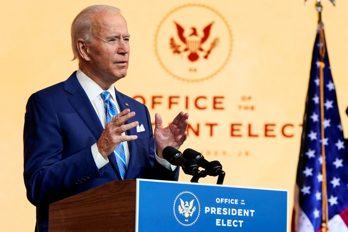 FILE PHOTO: U.S. President-elect Joe Biden delivers a pre-Thanksgiving speech at his transition headquarters in Wilmington, Delaware, U.S., November 25, 2020. REUTERS/Joshua Roberts/File Photo
