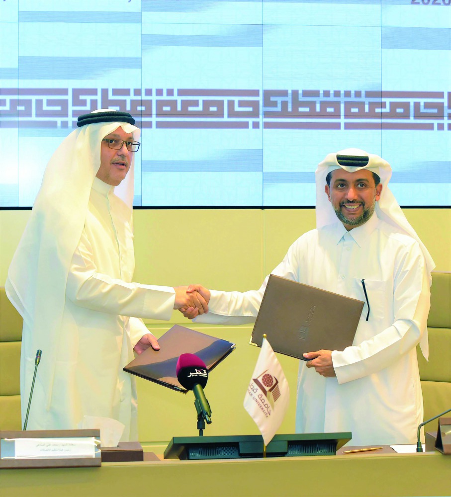 QU President, Dr. Hassan Rashid Al Derham, and President of CRA, Mohammed Ali Al Mannai, after signing the MoU at QU headquarters.