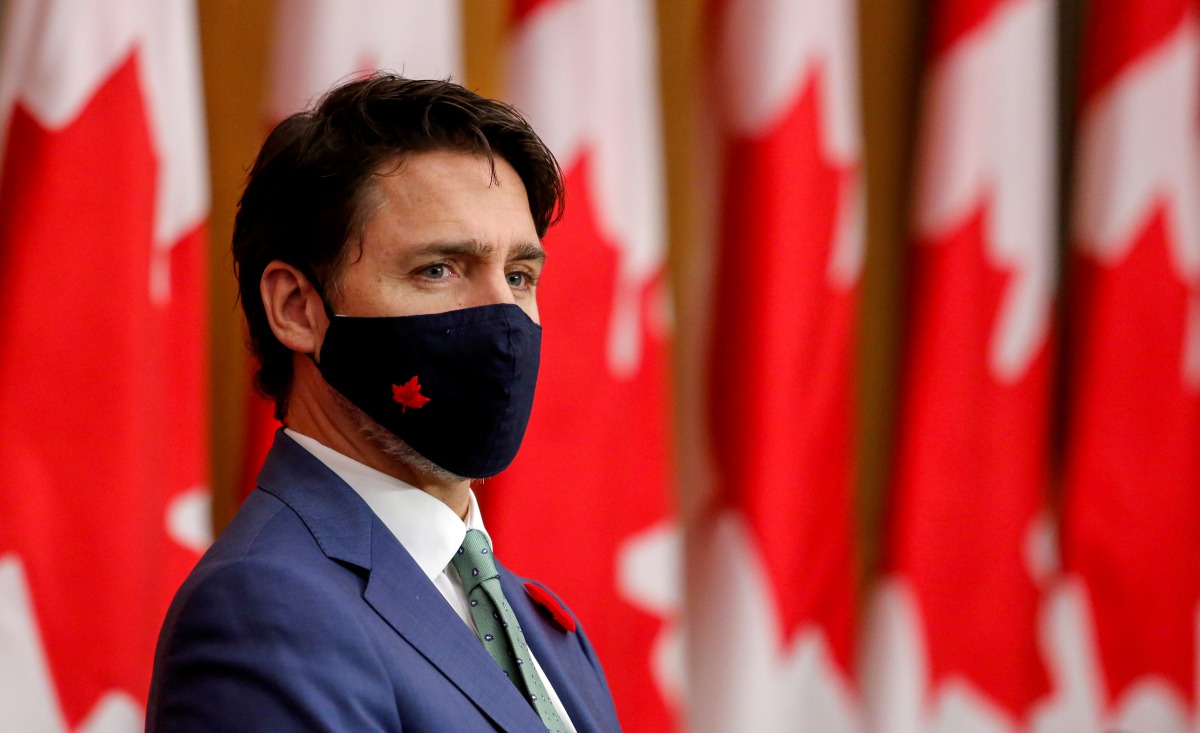 FILE PHOTO: Canadian Prime Minister Justin Trudeau listens while wearing a mask at a news conference held to discuss the country's coronavirus disease (COVID-19) response in Ottawa, Ontario, Canada November 6, 2020. REUTERS/Patrick Doyle//File Photo
