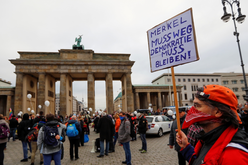 File photo: A demonstrator holds a sign reading 