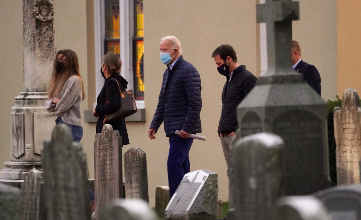 U.S. President-elect Joe Biden walks from the church after attending mass in Wilmington, Delaware, U.S., December 5, 2020. REUTERS/Kevin Lamarque
