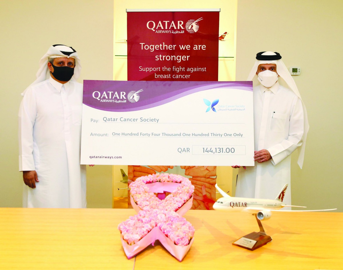 Qatar Airways Group Chief Executive, H E Akbar Al Baker, with the QCS Chairman, Sheikh Dr. Khalid bin Jabr Al Thani, during the cheque handing over ceremony. 
